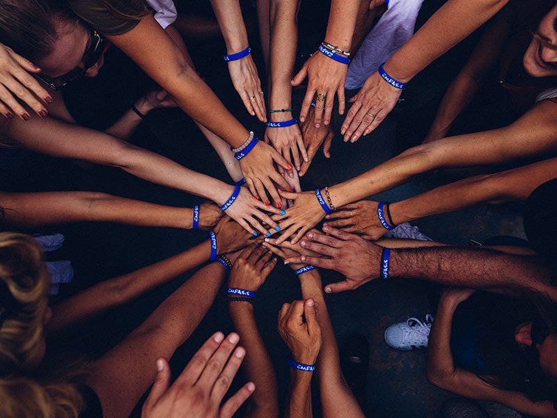 Hands joined together in a circle