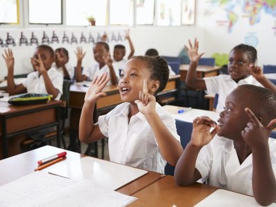 kids-showing-hands-during-a-lesson-at-an-elementary-school.jpg